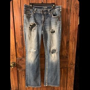 Silver Jeans Women’s Pioneer Bootcut Thick Stitch & Heavily Distressed